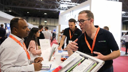 Wayne Matthews, Head of Sales, and the Tecman team talking to stand visitors at Battery Cells & Systems Expo 2023